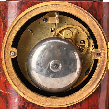 A French Empire 19th century gilt bronze mantel clock signed Lamiral.