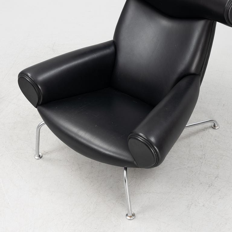 Hans J Wegner, an 'Ox Chair' and an ottoman, for Erik Jørgensen, Denmark, 2005 and 2010.