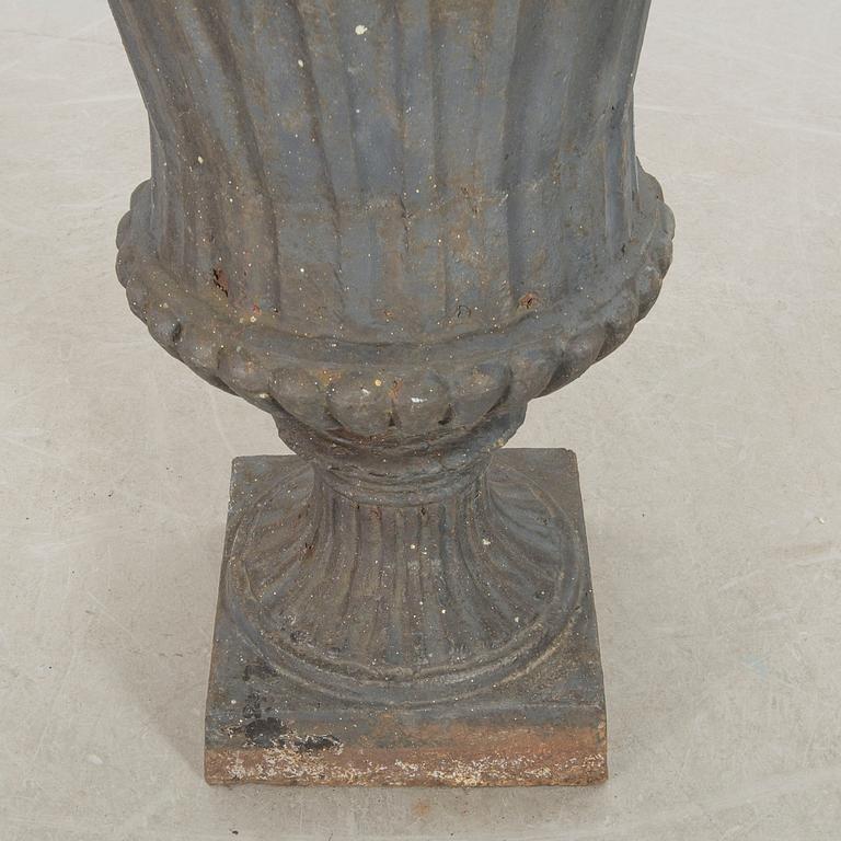 A cast iron garden urn.