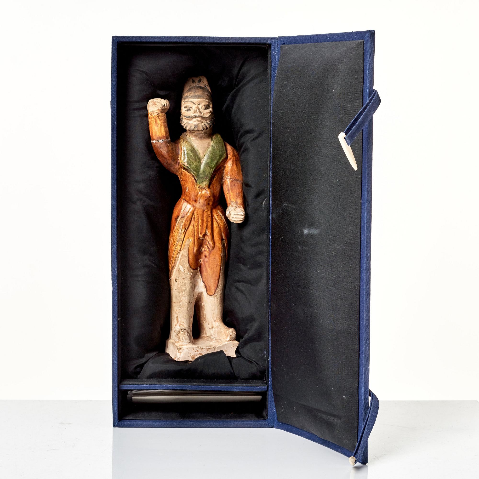 A pottery figure of a animal keeper, Tang dynasty (618-907).