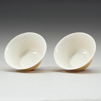 A pair of Imperial yellow bowls, Qing dynasty, Yongzheng six-character mark and of the period (1723-1735).