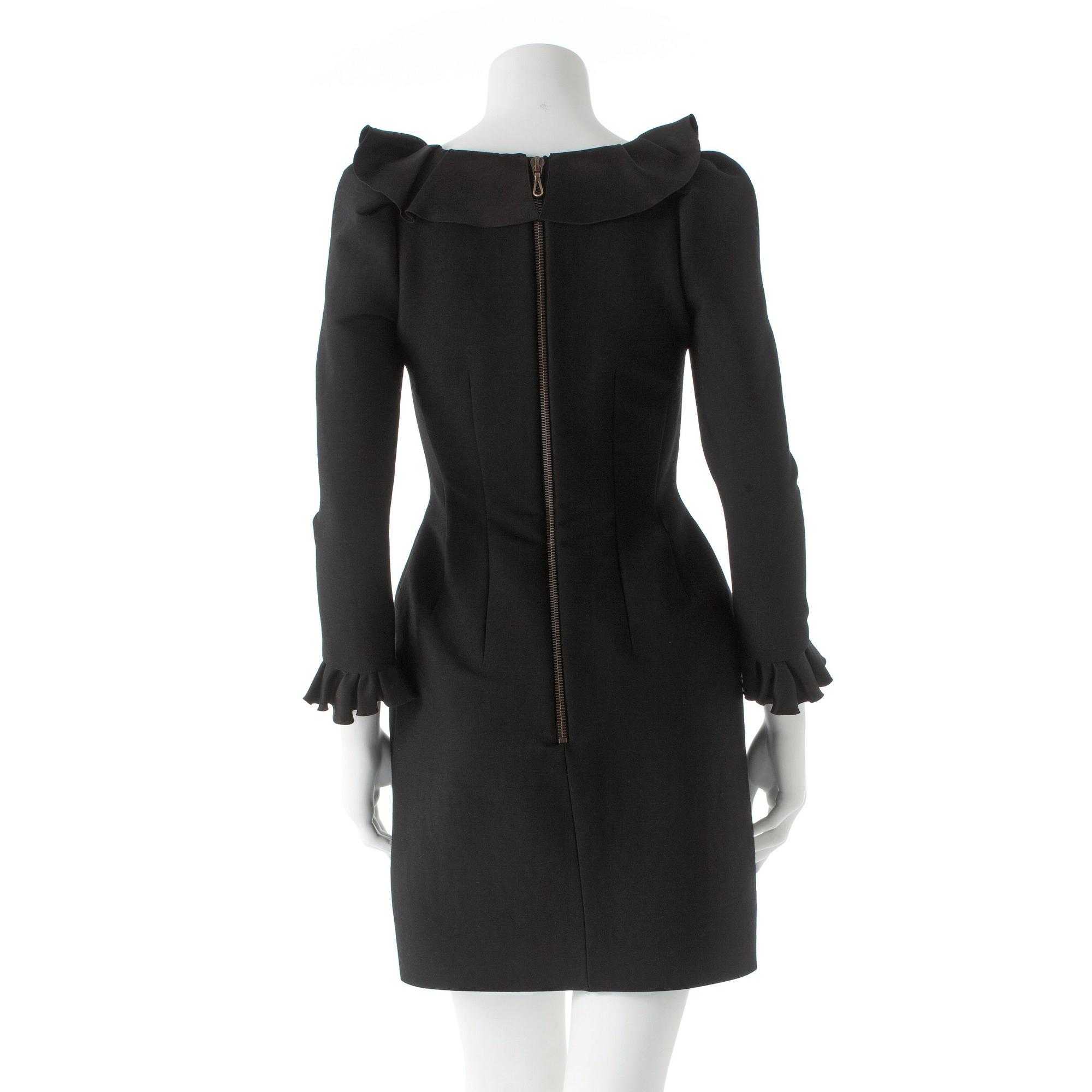 LANVIN, a black wool blend dress with ruffles.