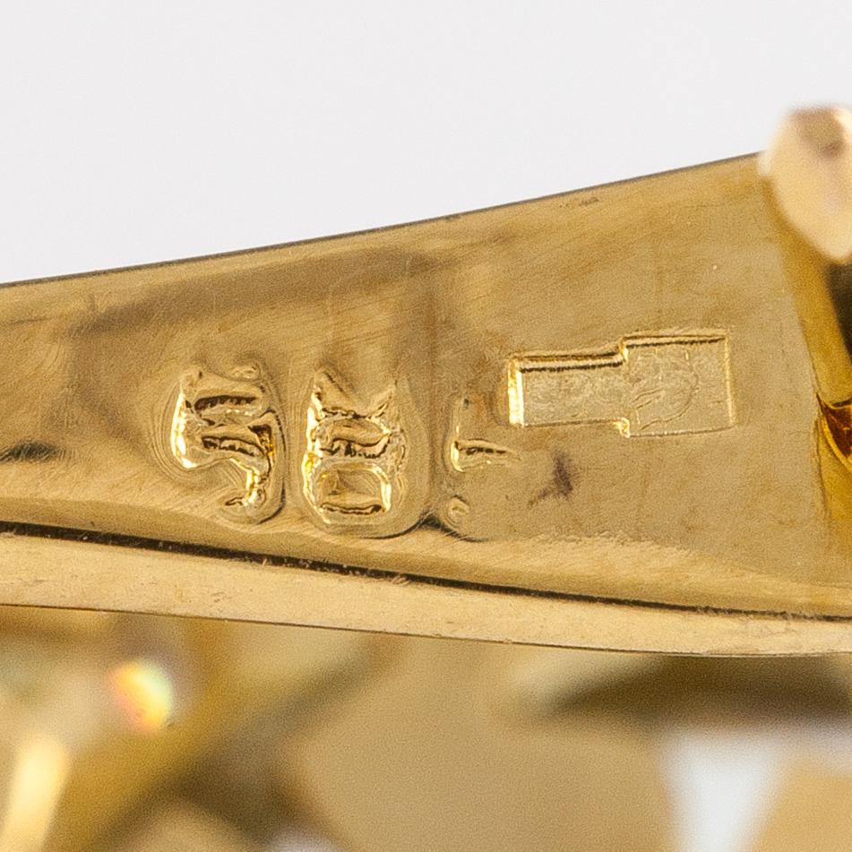 A pair of 14K gold earrings with diamonds ca. 0.12 ct in total and aquamarines.
