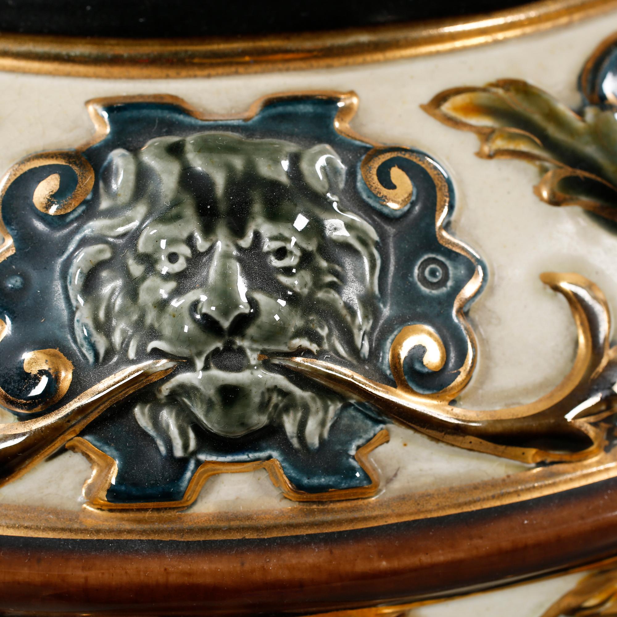 A majolica urn with pedestal from Rörstrand, around the year 1900.