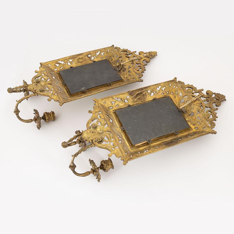 A pair of metal mirror sconces, first half of the 20th century.