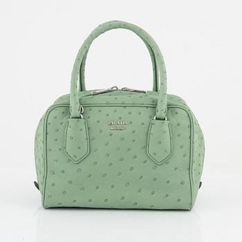 Prada, a green ostrich leather bag.