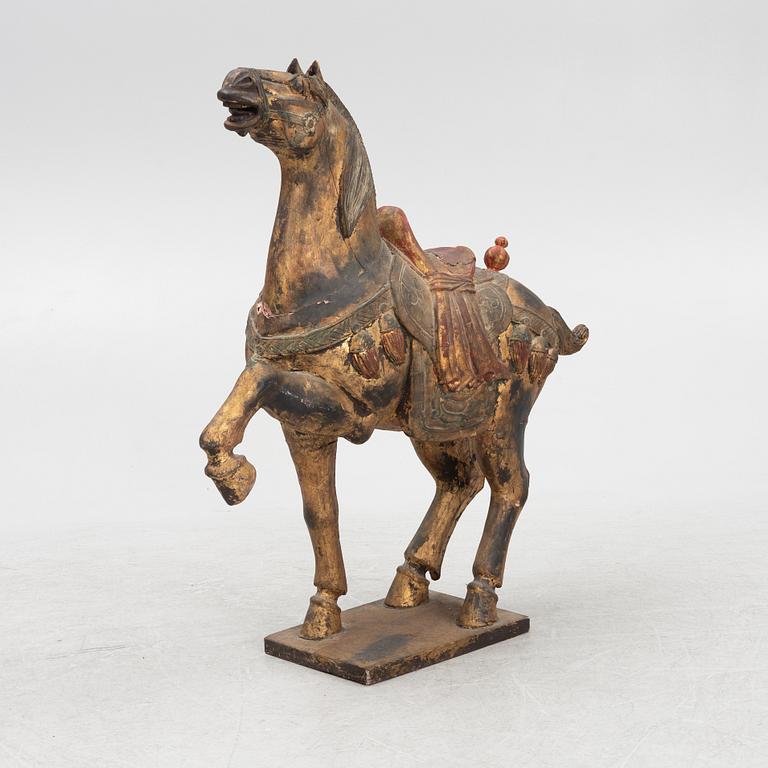 A carved wooden horse.