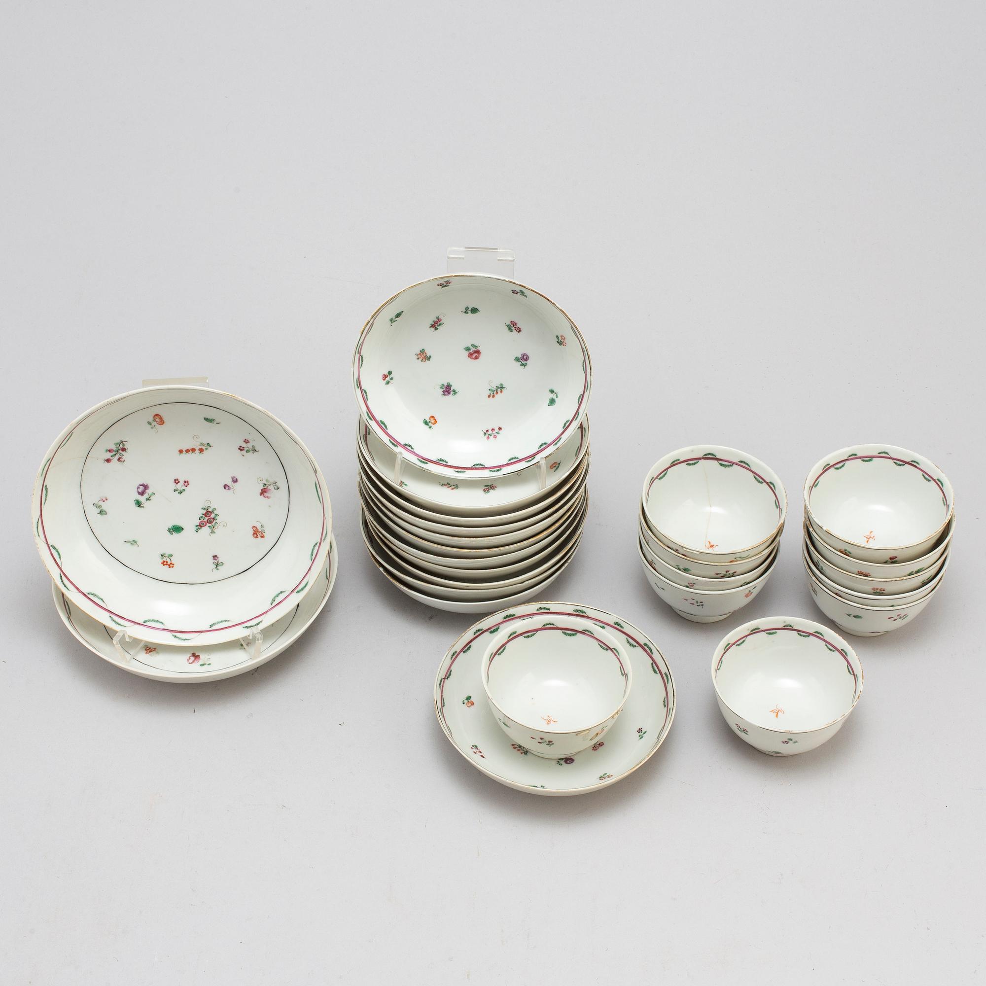 Eleven Chinese porcelian cups and saucers and two small dishes, circa 1800.