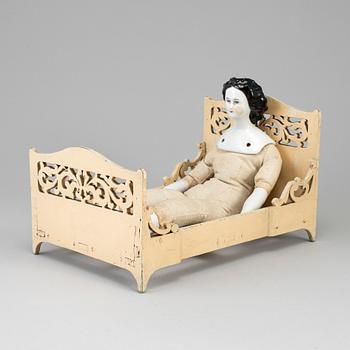 DOLL AND A DOLL'S BED, 19th/20th century.