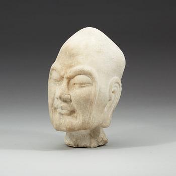 A carved stone figure of a Chángméi Luóhàn, Ming dynasty or older.