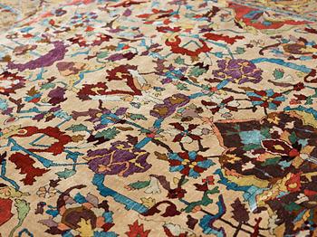 A RUG. An antique silk Kashan so called Motachem. 202,5 x 136,5 cm.