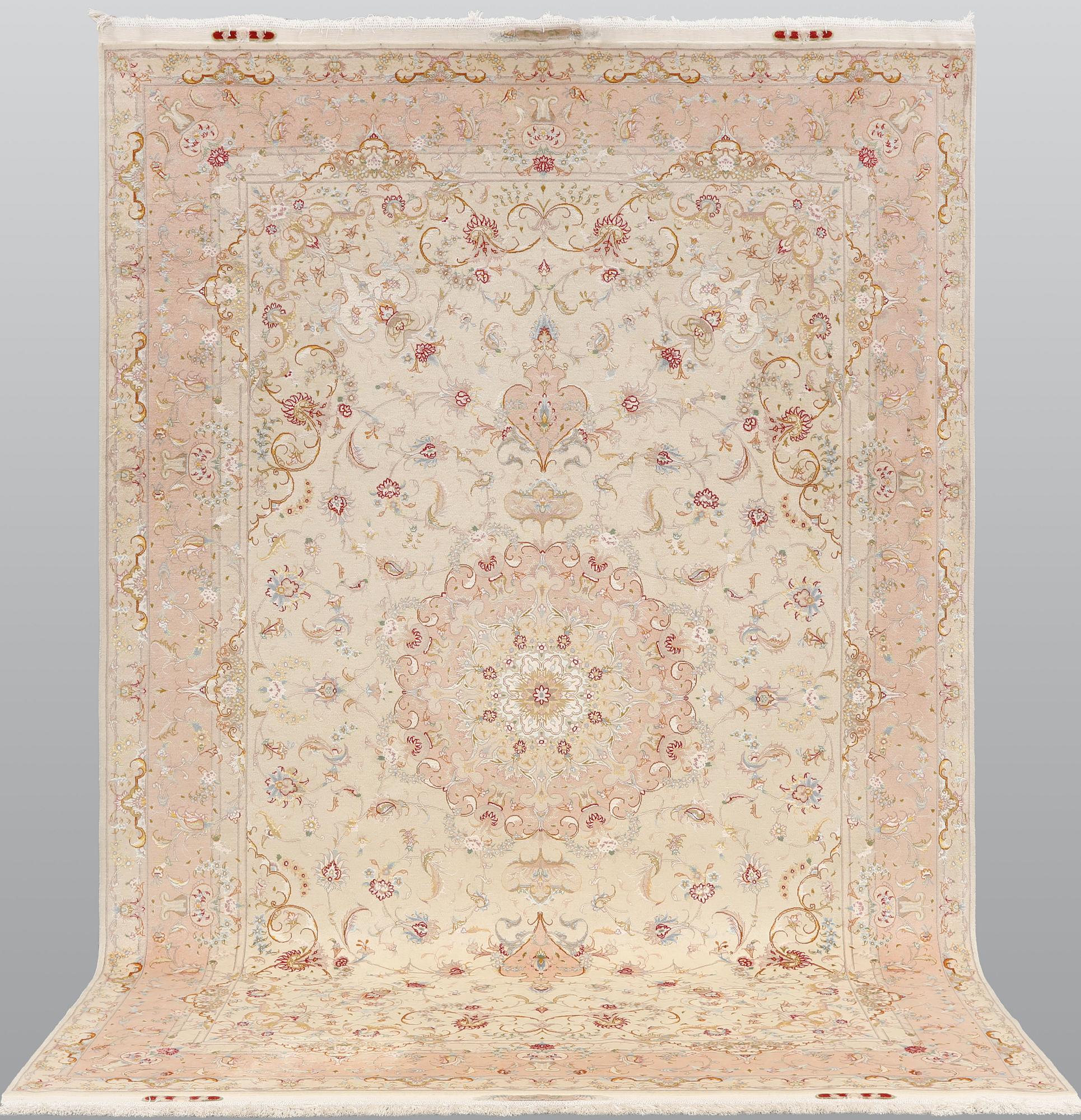 A Tabriz part silk carpet, signed, 305 x 203 cm.