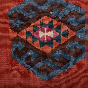 An antique Anatolian kilim, around 349 x 145 cm.