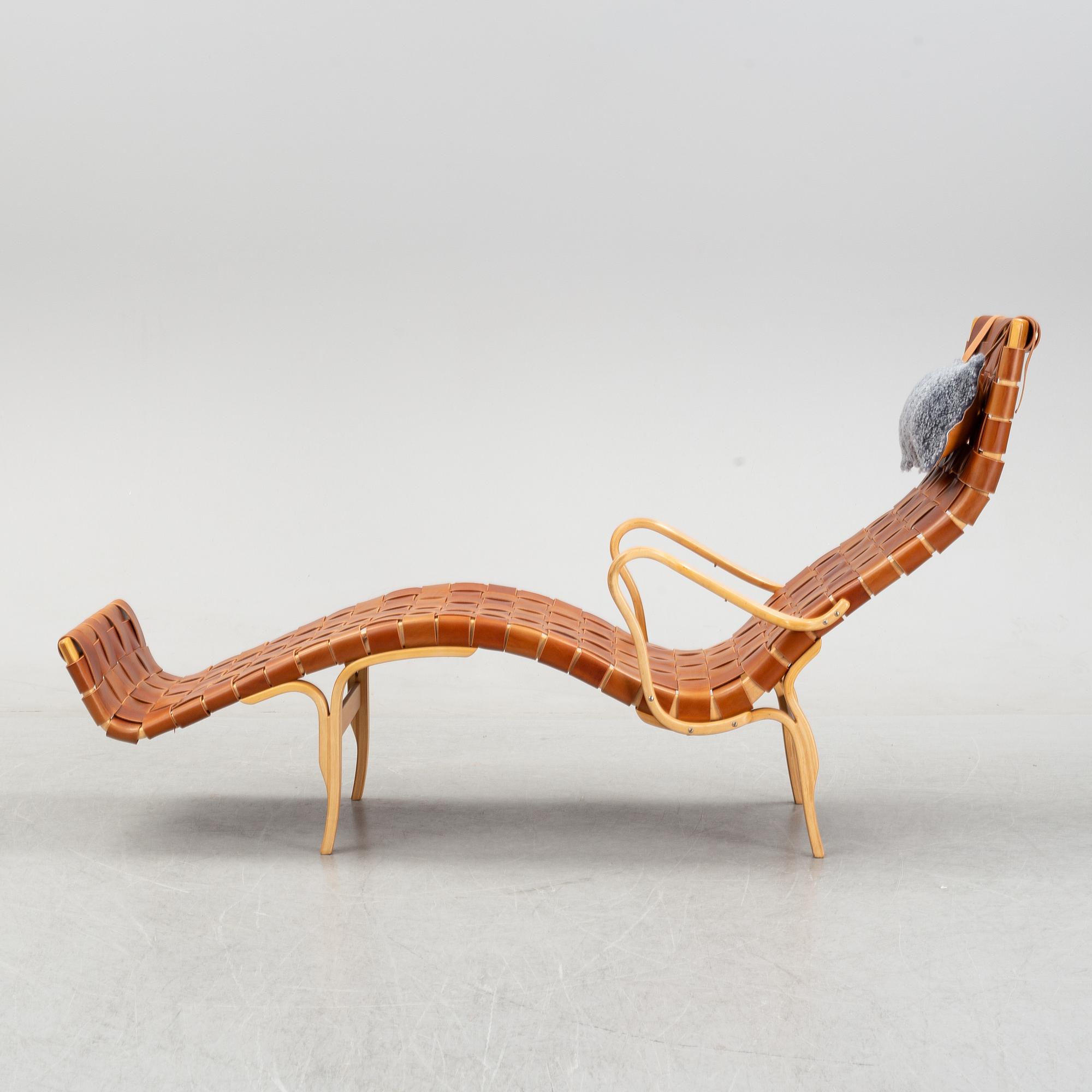A 'Pernilla 3' lounge chair by Bruno Mathsson for Firma Karl Mathsson, dated 1973.