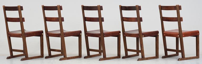 A set of five Axel Einar Hjorth 'Funkis' brown leather and stained wood chairs, Nordiska Kompaniet, Sweden ca 1930.