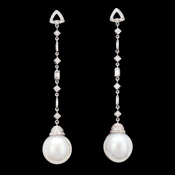 1038. A pair of cultured South sea pearl and diamond earrings.