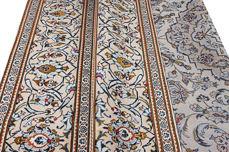 A Kashan carpet, c. 355 x 238 cm.