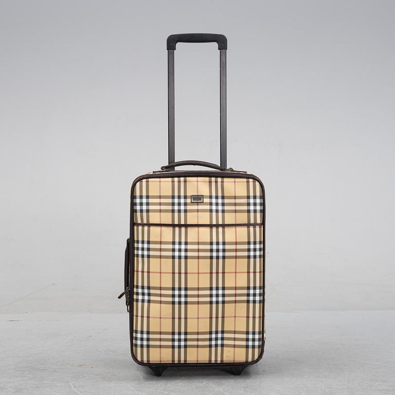 Burberry, a Nova Check canvas suitcase.