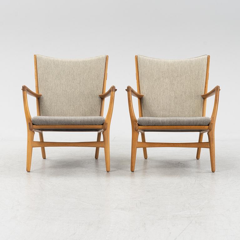 Hans J Wegner, a pair of model AP-16 armchairs, Denmark mid 20th century.