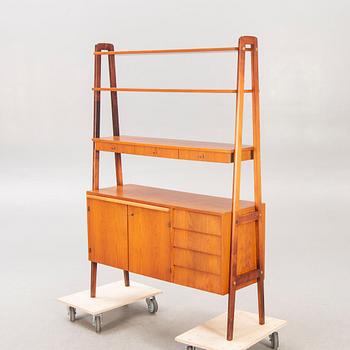 A teak mid 1900s book shelf.