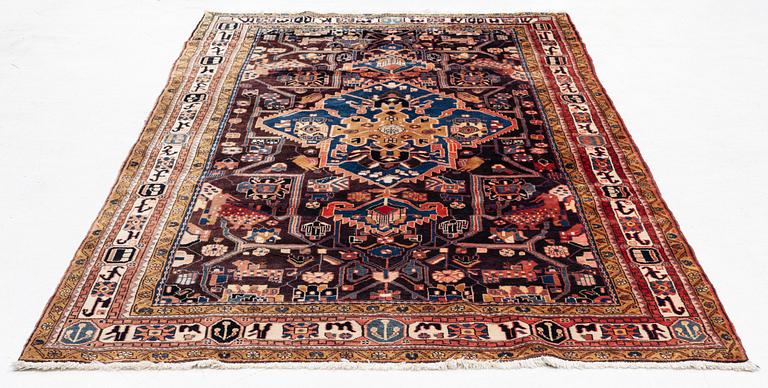 An oriental rug, c. 300 x 155 cm.