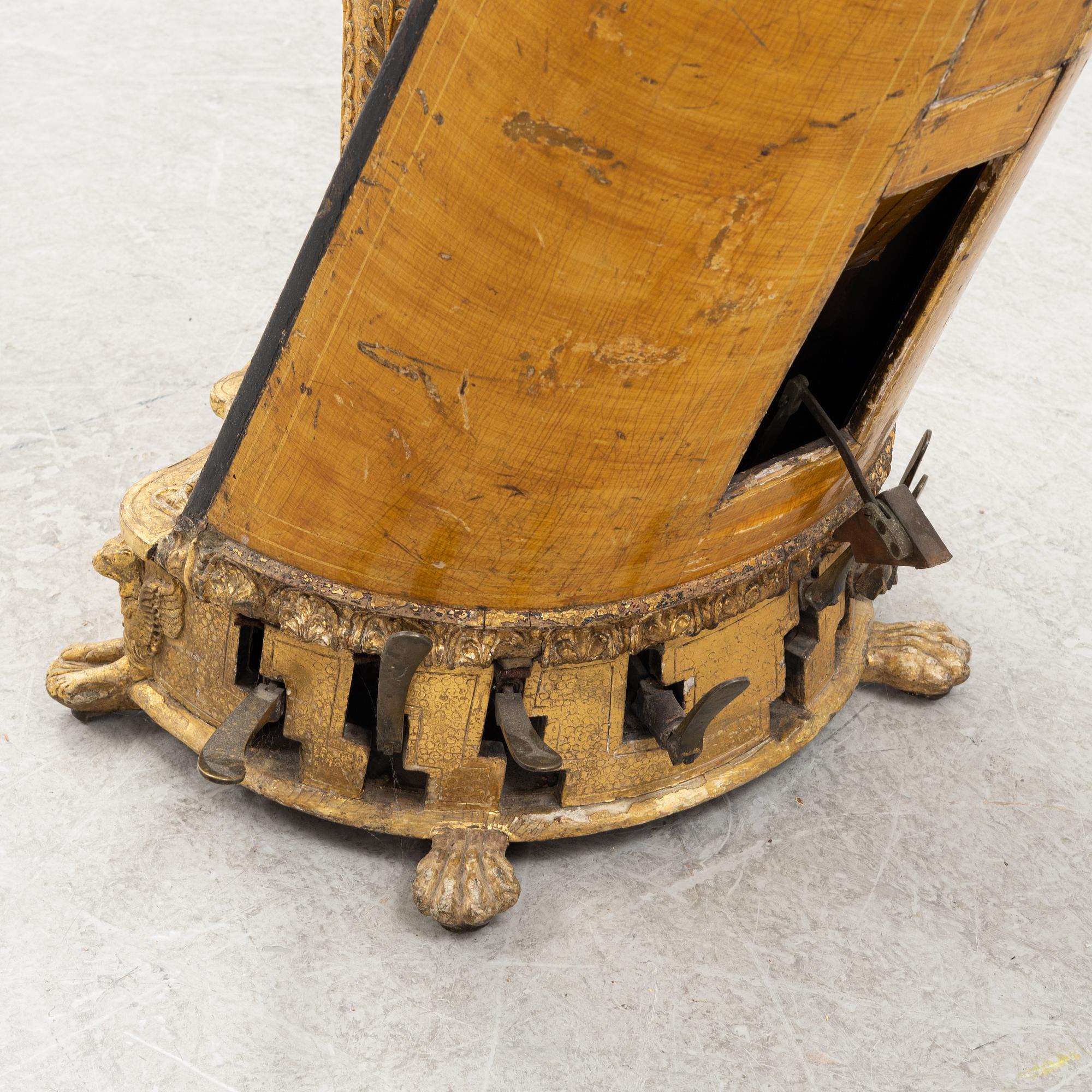 A pedal harp by Jacob & James Erat, London, No 1610, probably made between 1825-1830.