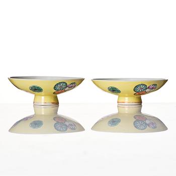 A pair of yellow glazed covers, late Qing dynasty, with Qianlong mark.