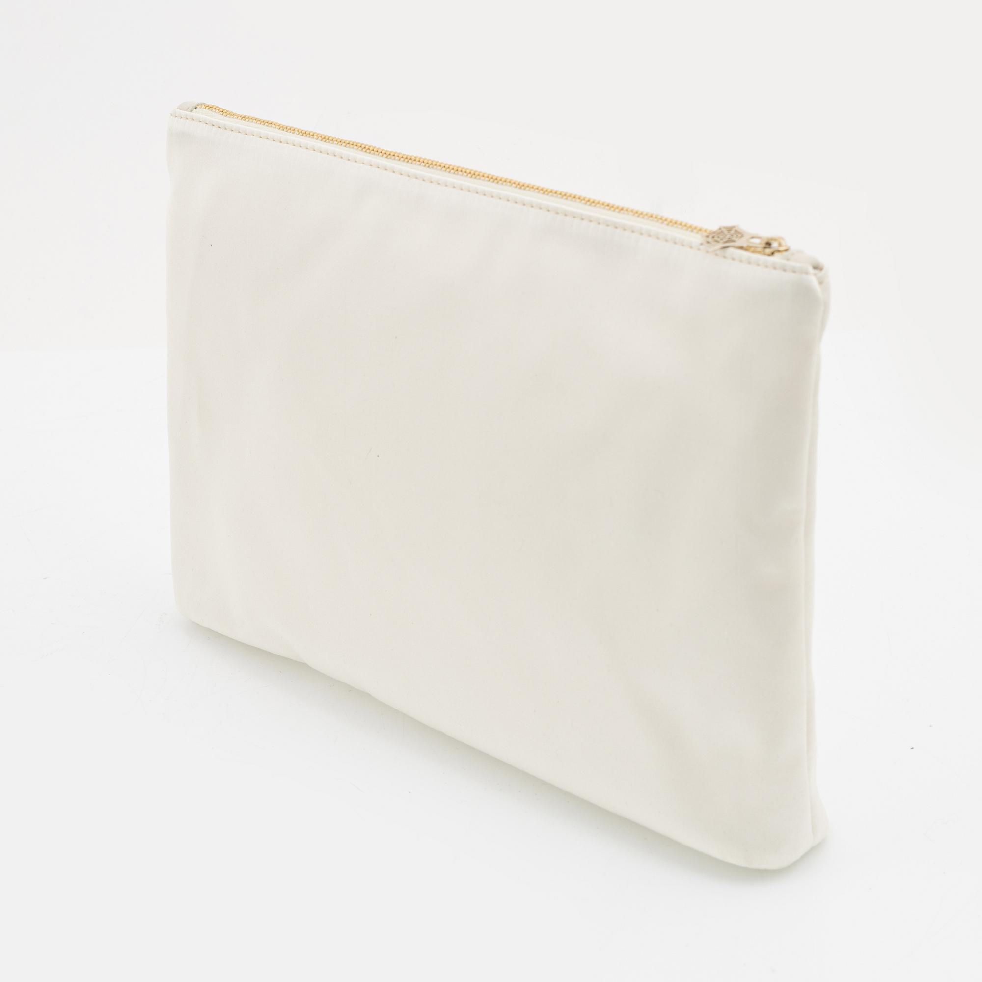 Charlotte Olympia, a pair of 'Cat nap' silk flats, a sleeping mask and a toilet bag, size S.