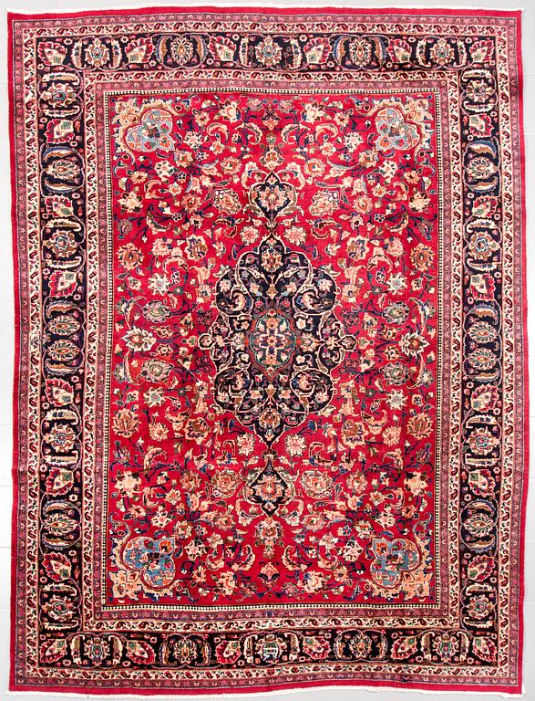 A Meshad rug, signed, 335 x 245 cm.