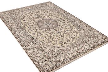 A Nain carpet, part silk, 6 laa, c. 295 x 205 cm.
