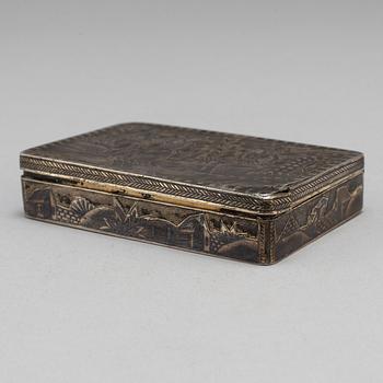 A Russian mid 19th century silver-gilt and niello snuff-box, mark of Moscow.