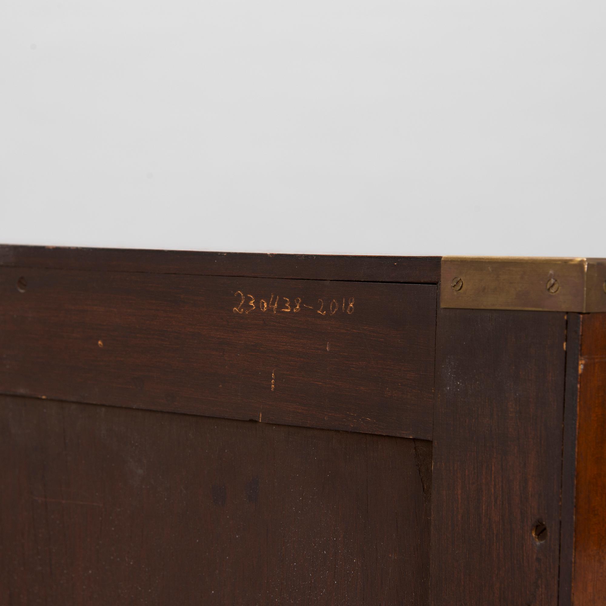 A chest of drawers, England, second half of the 20th century.
