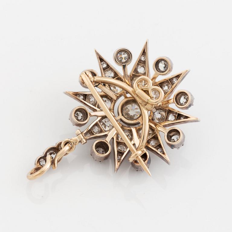 A 19th century gold and silver brooch/pendant set with old-cut diamonds.