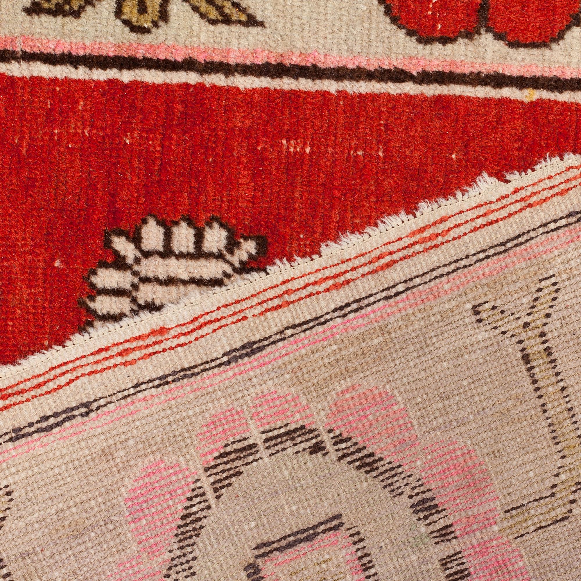 A CARPET, an antique/semi-antique Khotan figural, ca 259,5 x 160,5 cm.