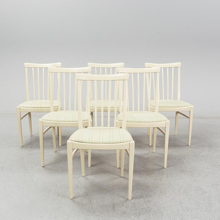A dining table with six chairs by Carl Malmsten. Second half of the 20th Century.
