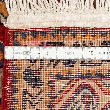 A rug, 215 x 130 cm.