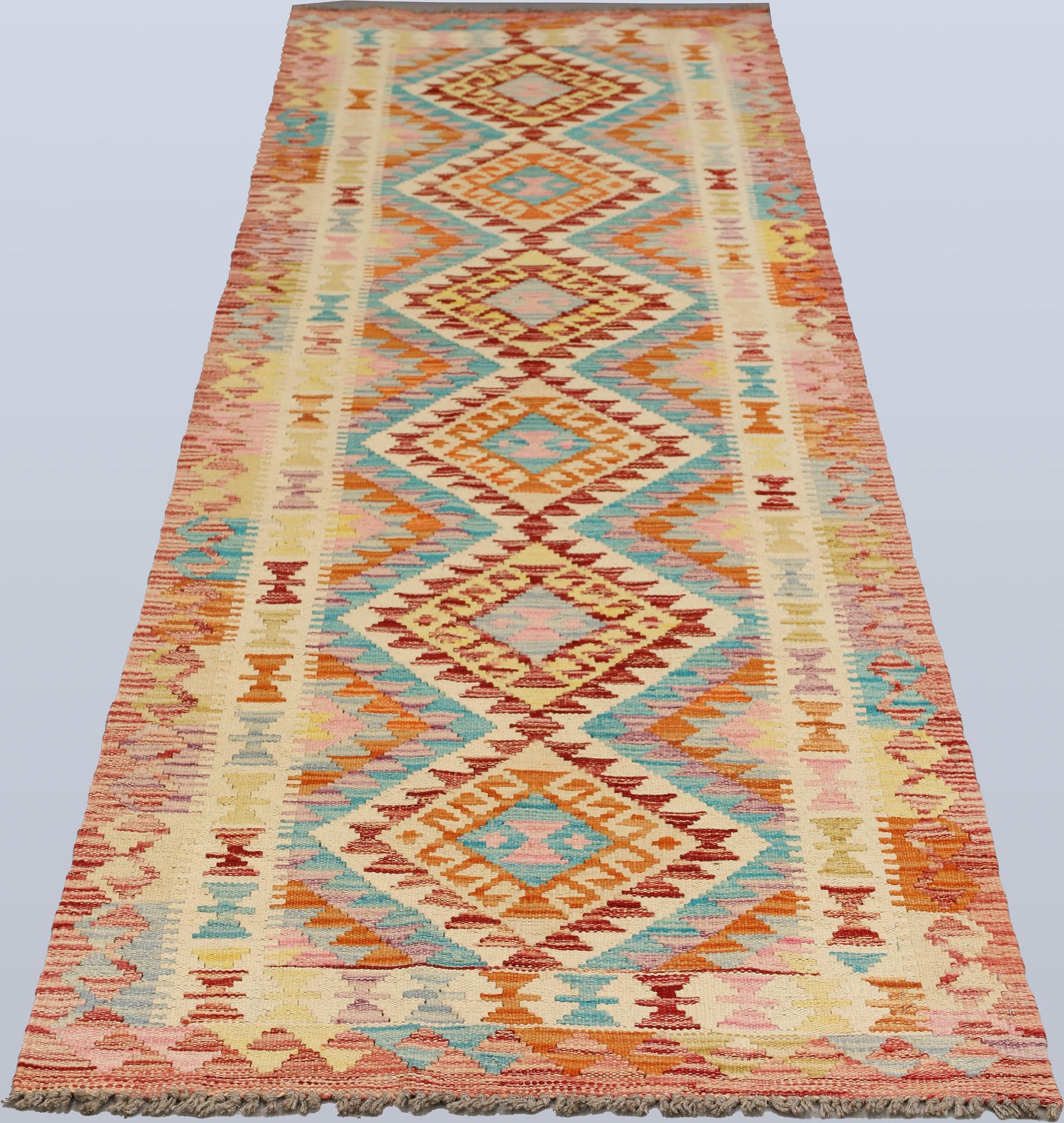 A Kilim runner, c. 293 x 78 cm.