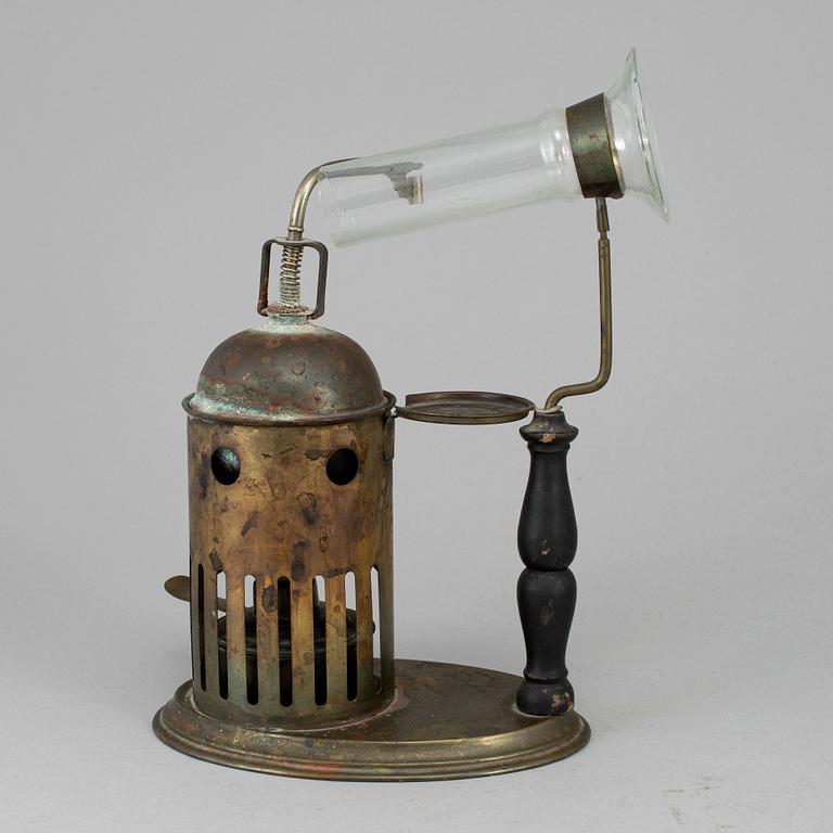 A tinplate burner, 20th century.