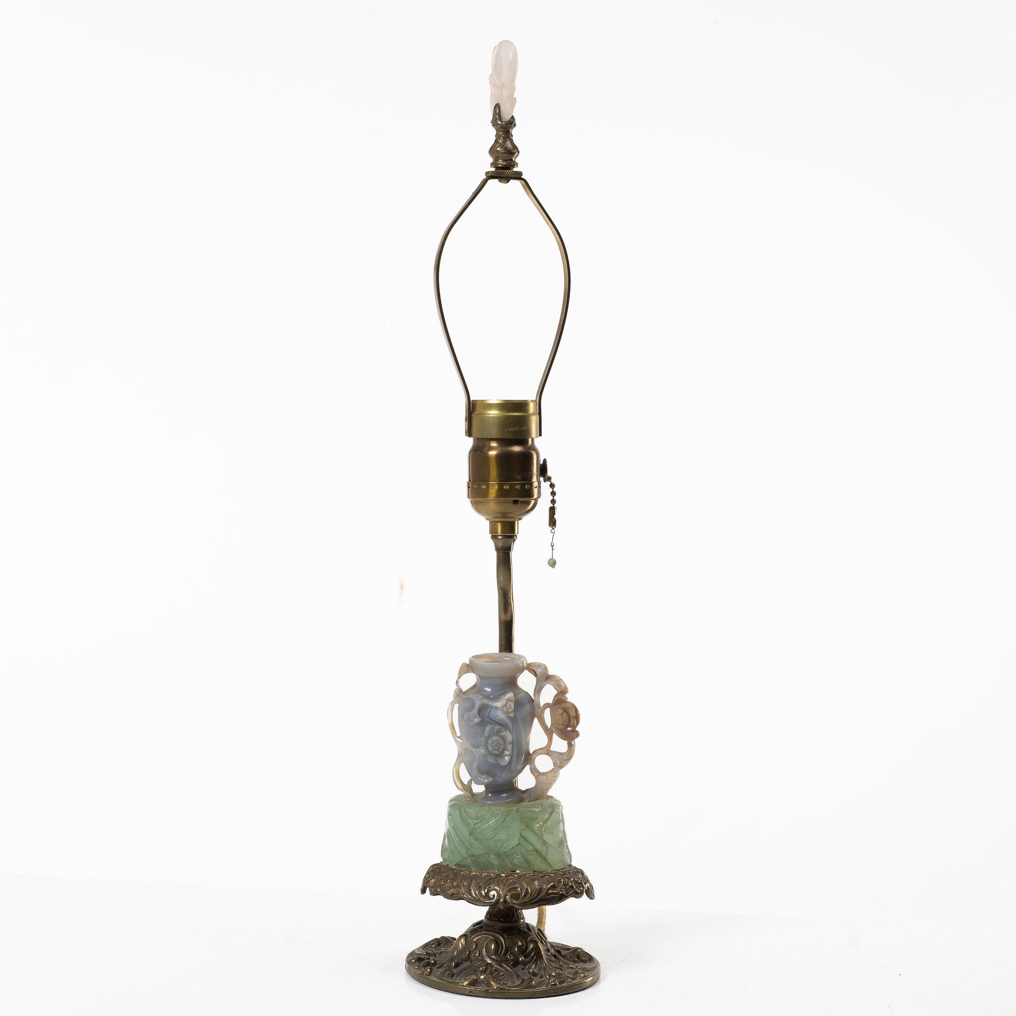 A Chinese table lamp with a carved stone vase with cover, 20th century.