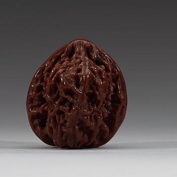 Two pairs of carved walnut hand exercisers, late Qing dynasty (1644-1912).