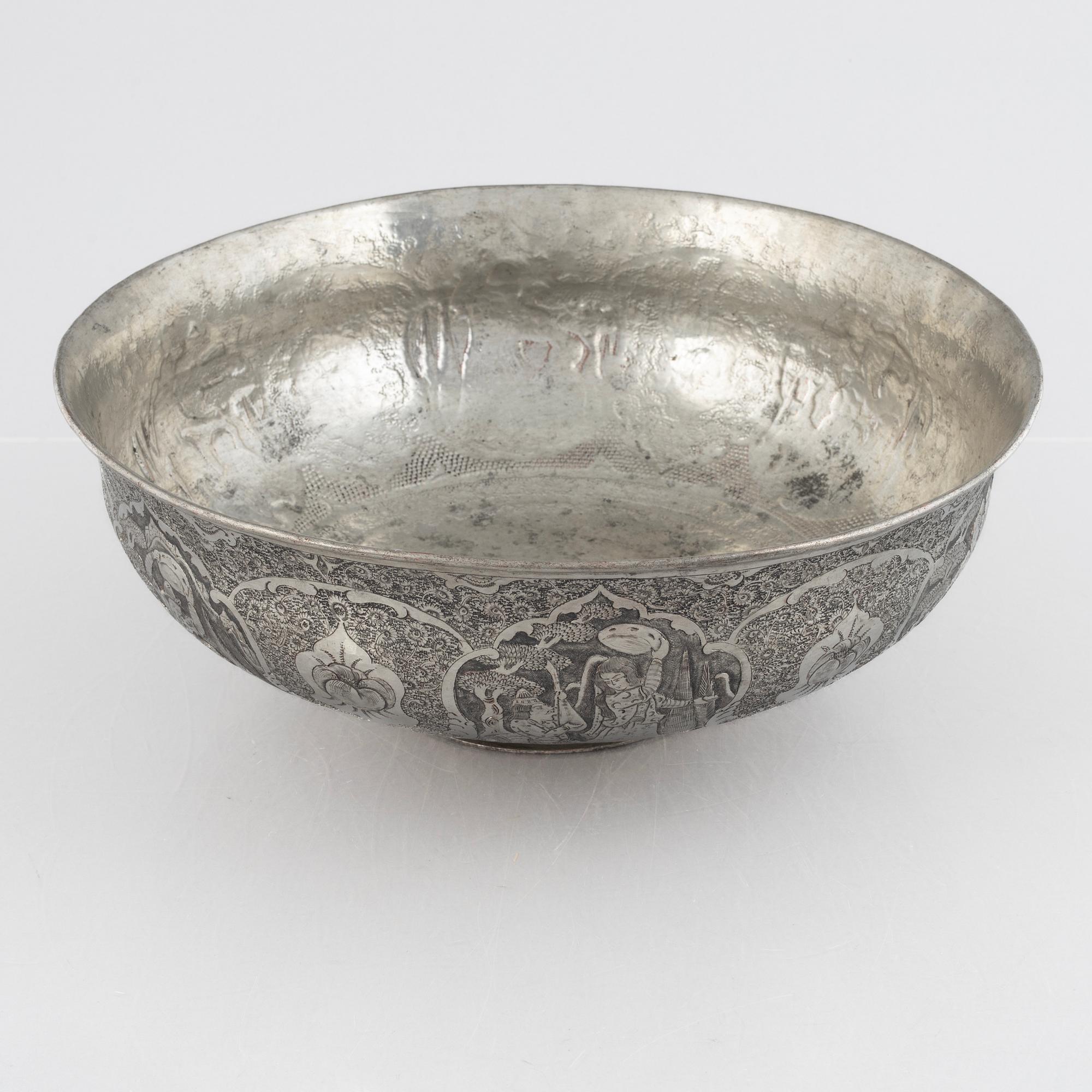 A west Asian repoussé silver and copper vessle, circa 1900.