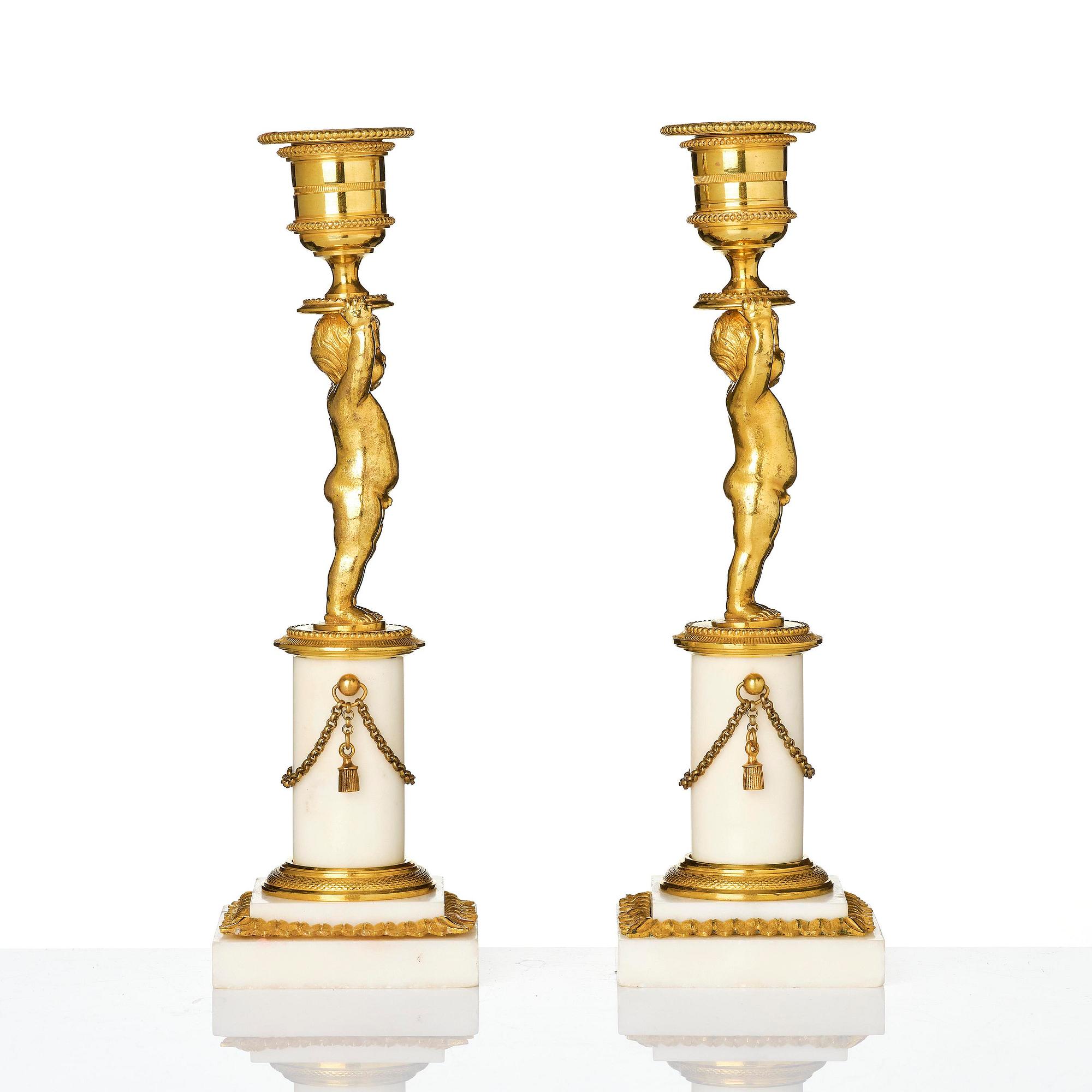 A pair of late Gustavian ormolu and white marble candlesticks, Stockholm, late 18th century.
