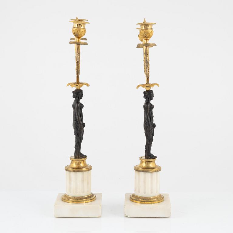 A pair of French Louis XVI two-light marble and ormolu candelabra, late 18th century.