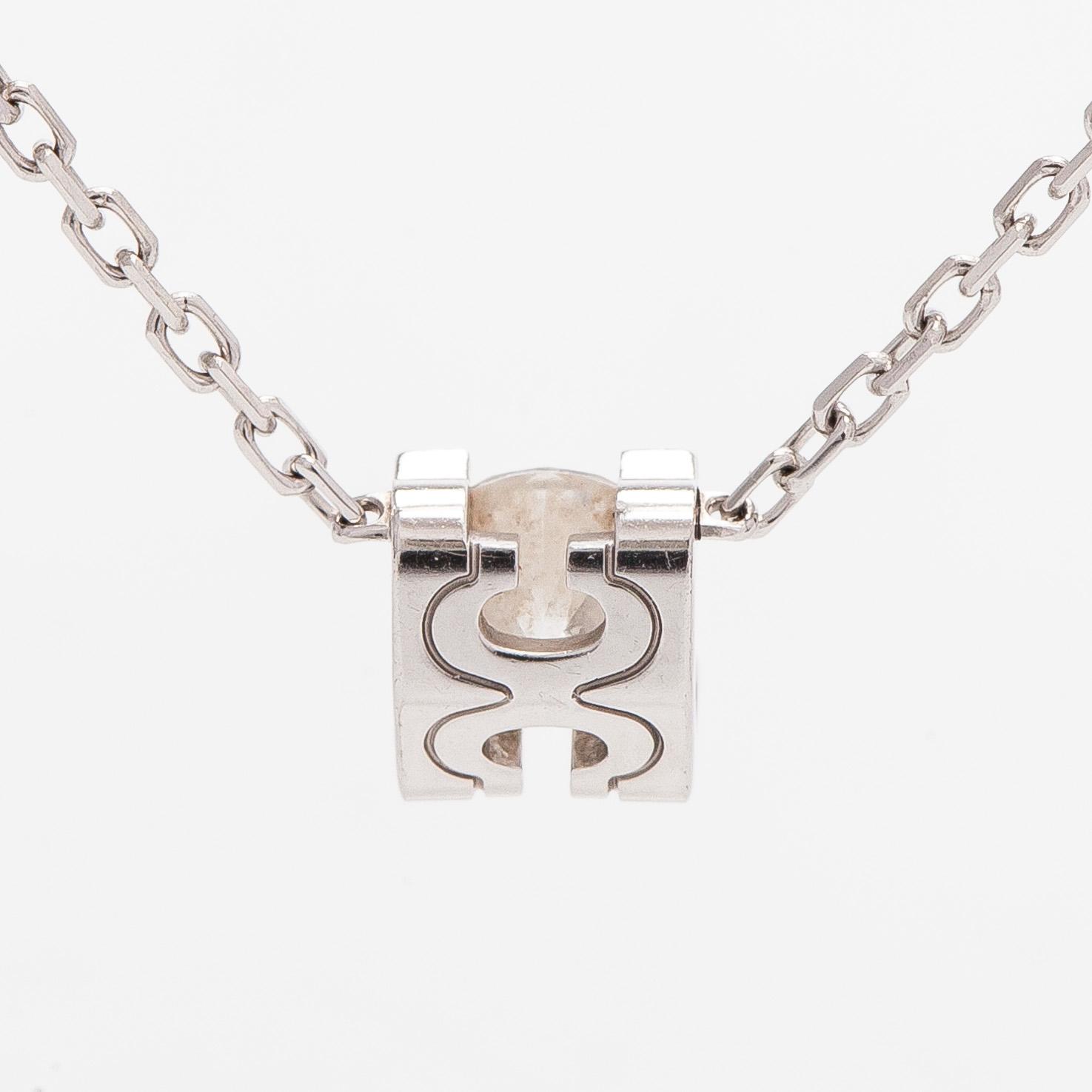 Cartier, an 18K white gold 'C de Cartier' necklace with a brilliant-cut diamond.