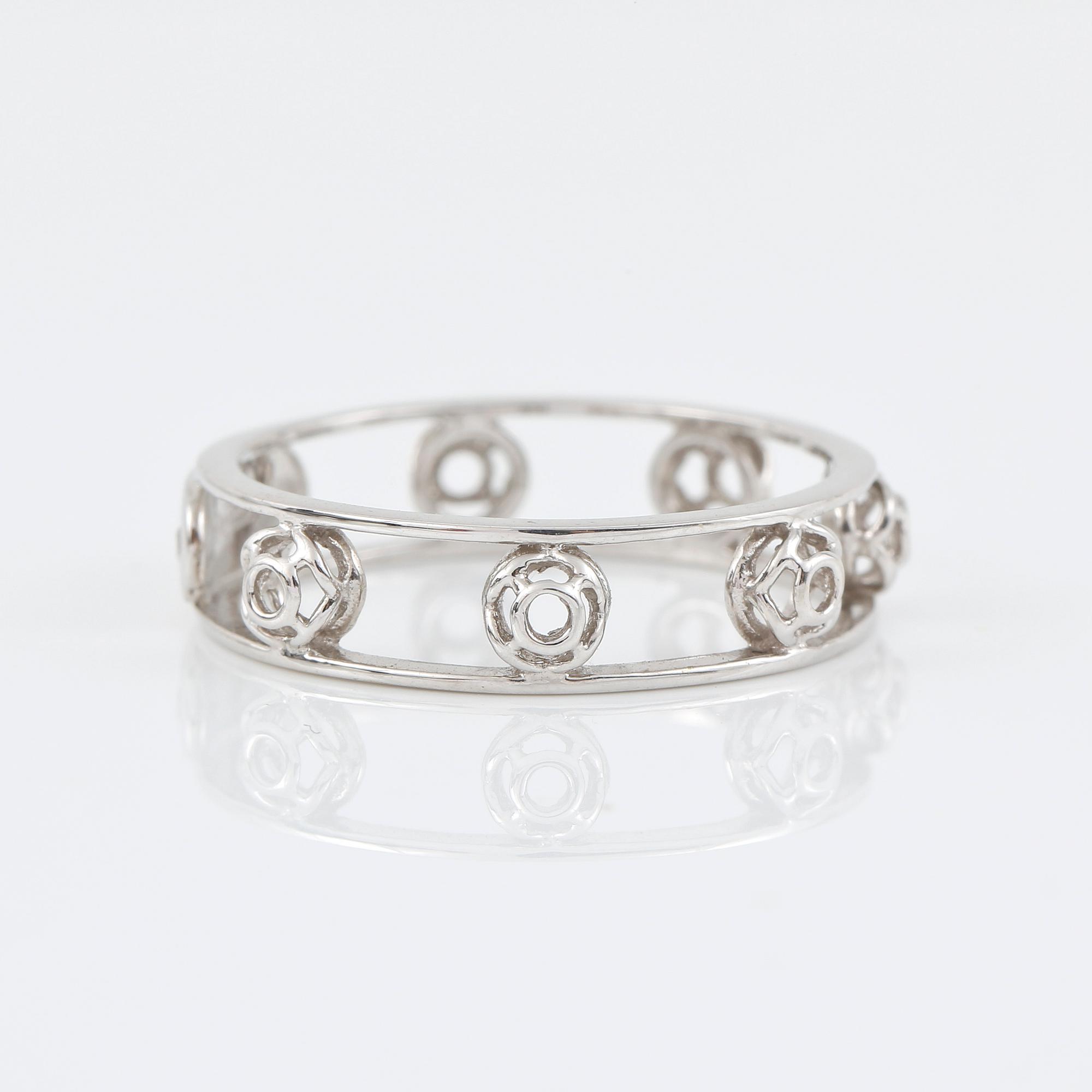 RING, Bliss, Italien. genombruten 18K vitguld med diamant på logoplatta 0.007ct.
