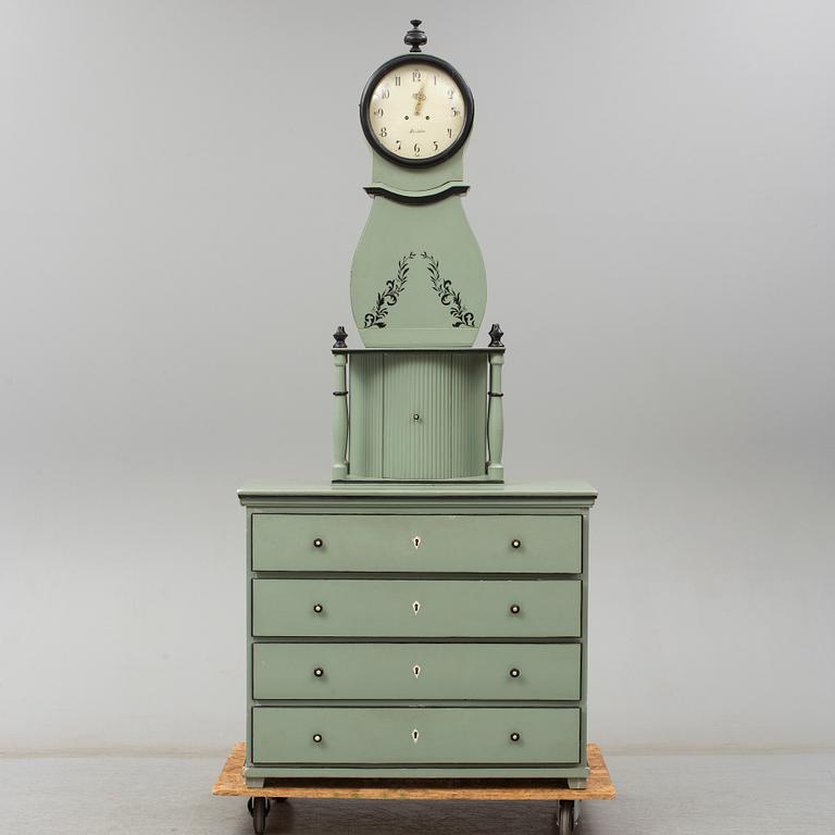 A combined clock and chest of drawers from late 19th  century.