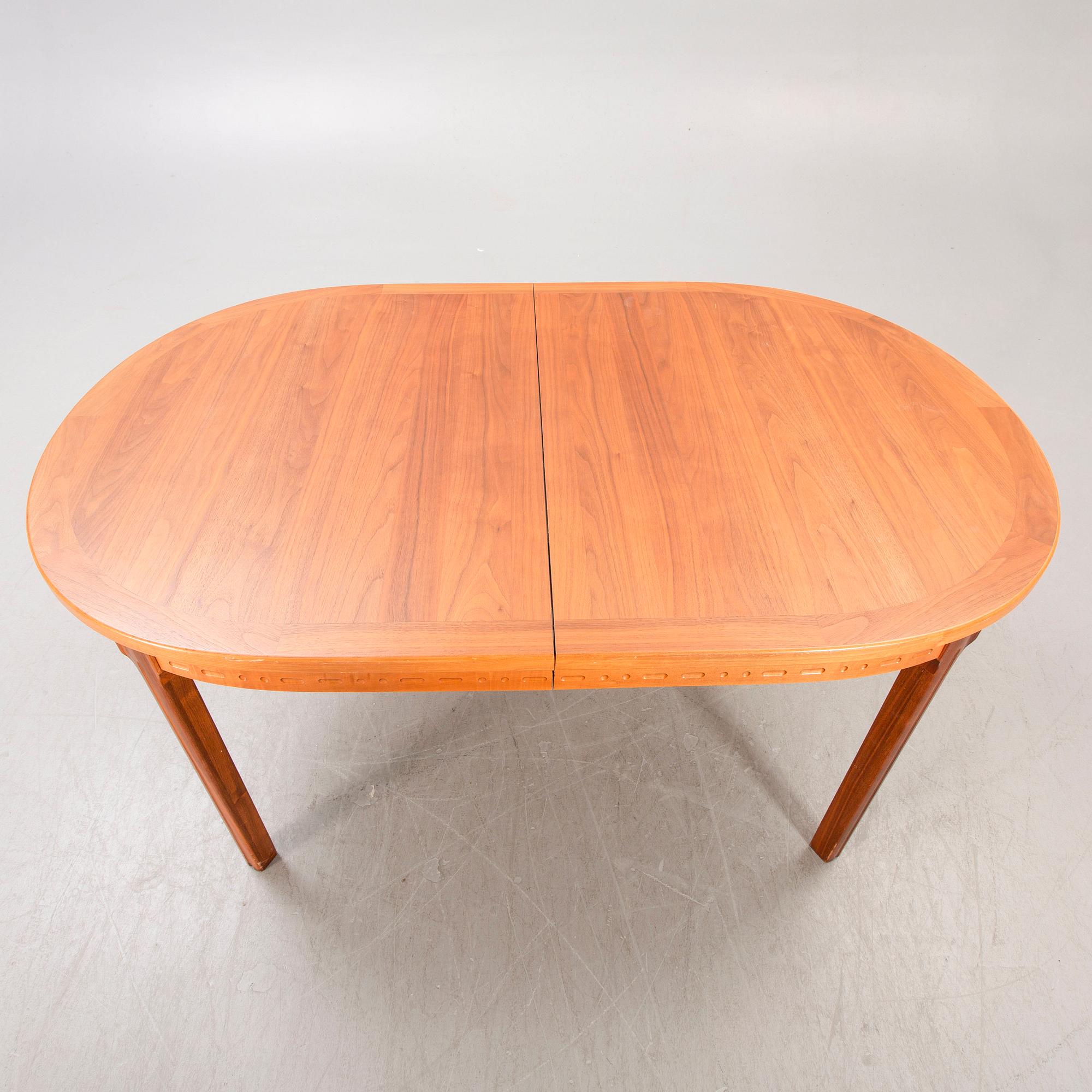 A Nils Jonsson teak and walnut 1960s dining table.