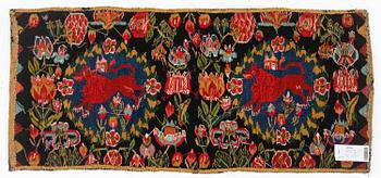 A cushion, 'Red Lion' (Rött Lejon), tapestry weave, c. 102 x 46cm, southwestern Scania, first part of the 19th century.