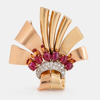 1111. A 14K gold brooch set with cabochon-cut rubies and old-cut diamonds.