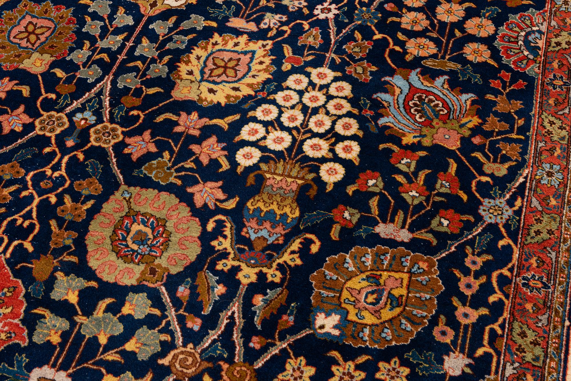 A semi-antique Tabriz carpet, c. 395 x 295 cm.